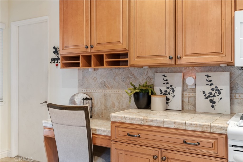 911 Diamond Road Placentia, CA 92870 - Photo 12 of 31 a bathroom with a granite countertop sink and a white cabinets