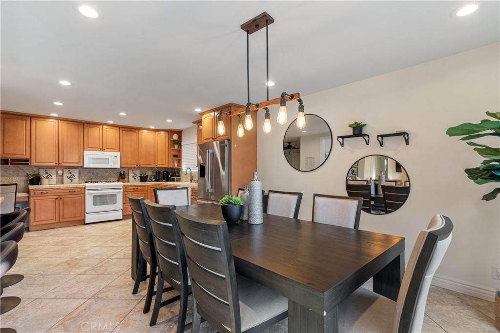 911 Diamond Road Placentia, CA 92870 - Photo 14 of 31 a view of a dining room with furniture and a chandelier