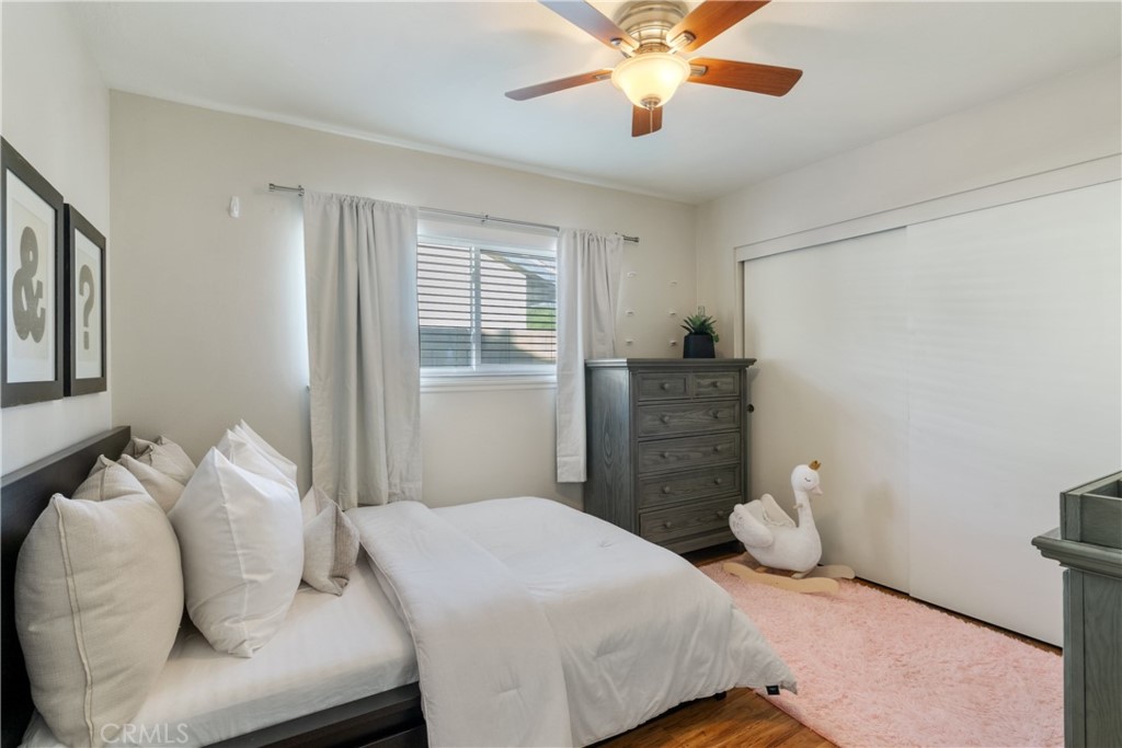 911 Diamond Road Placentia, CA 92870 - Photo 19 of 31 a bedroom with a bed and wooden floor