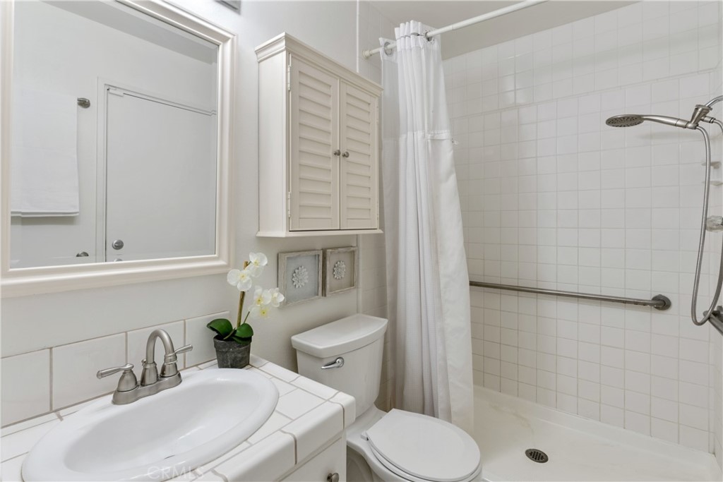 911 Diamond Road Placentia, CA 92870 - Photo 22 of 31 a bathroom with a sink toilet and shower