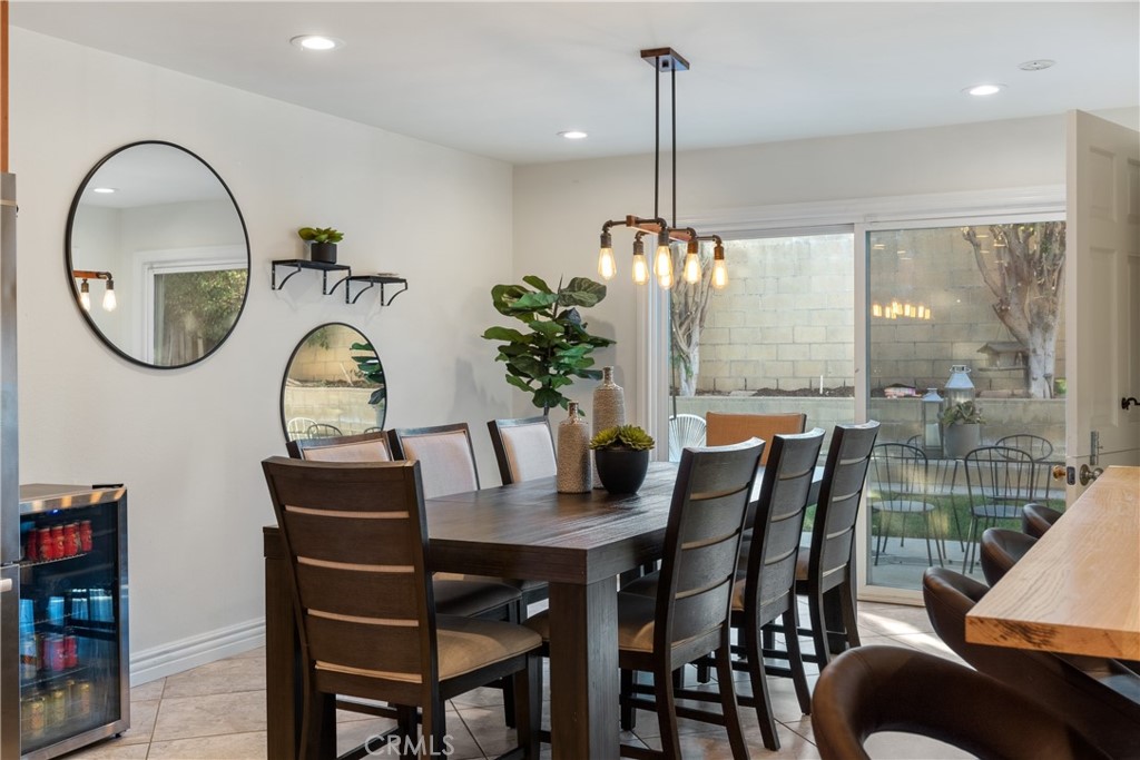 911 Diamond Road Placentia, CA 92870 - Photo 3 of 31 a dining room with furniture a chandelier and wooden floor