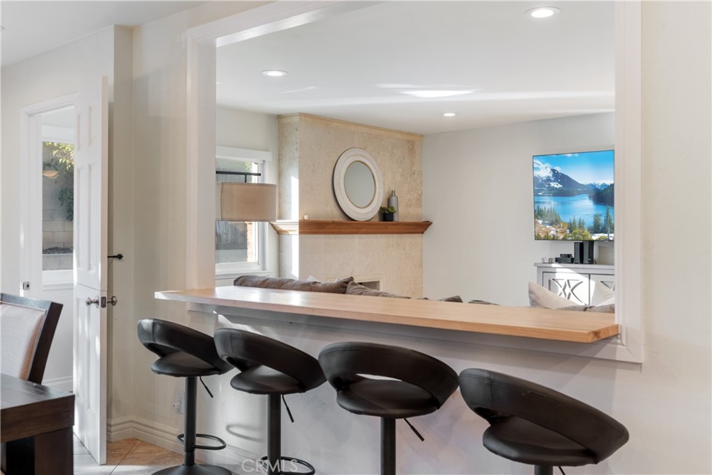 911 Diamond Road Placentia, CA 92870 - Photo 4 of 31 a kitchen with a sink and a stove with wooden floor