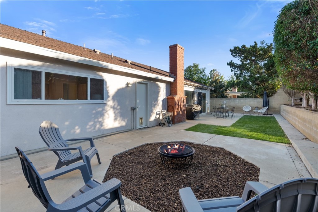 911 Diamond Road Placentia, CA 92870 - Photo 6 of 31 a view of a backyard with chair and table