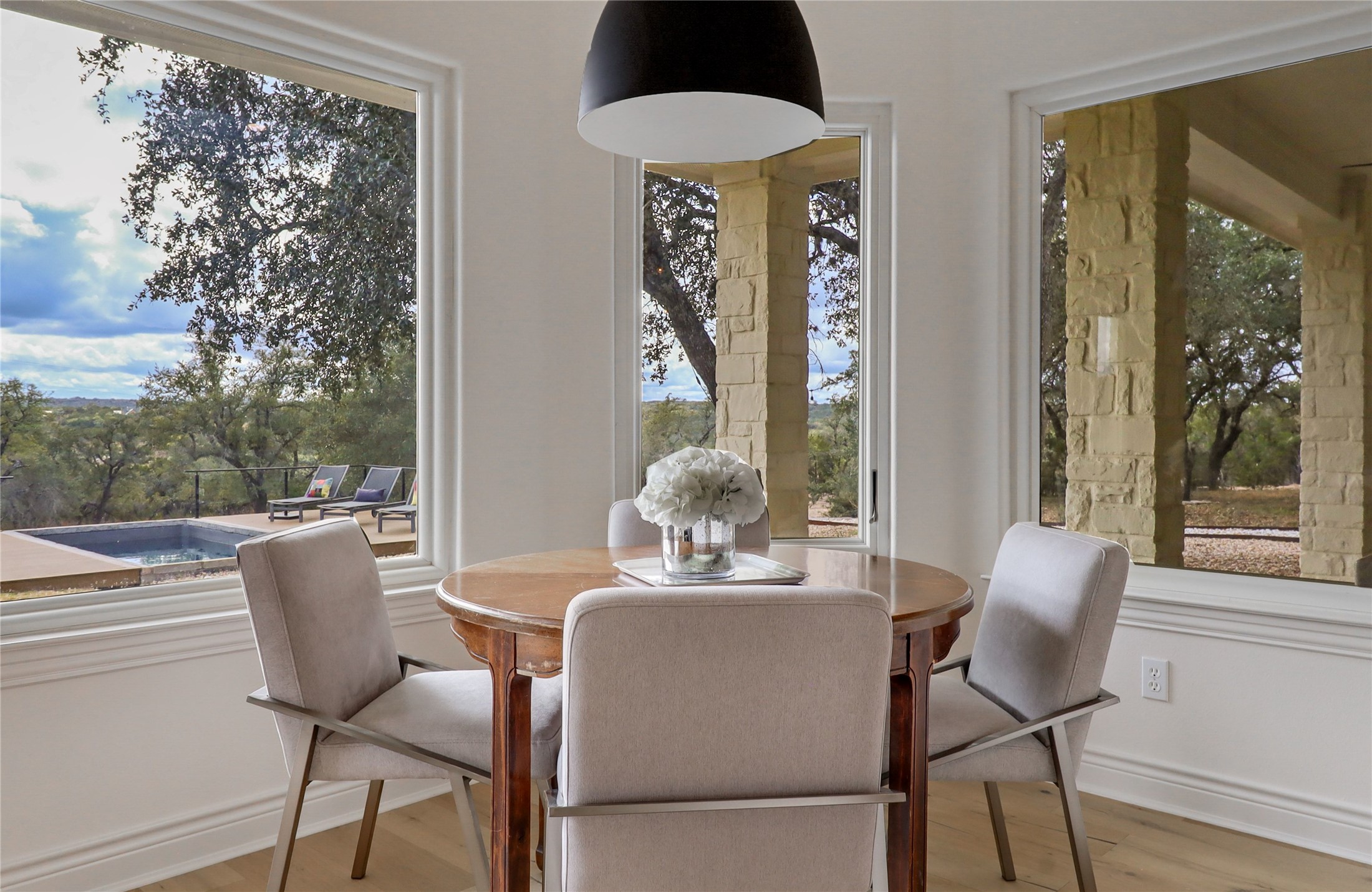 1100 Norwood Road Dripping Springs, TX 78620 - Photo 12 of 38 a dining room with furniture and wooden floor