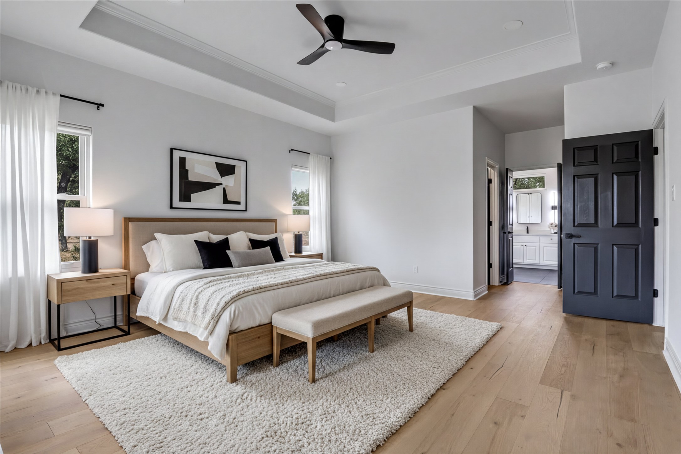 1100 Norwood Road Dripping Springs, TX 78620 - Photo 15 of 38 a spacious bedroom with a bed and cabinet