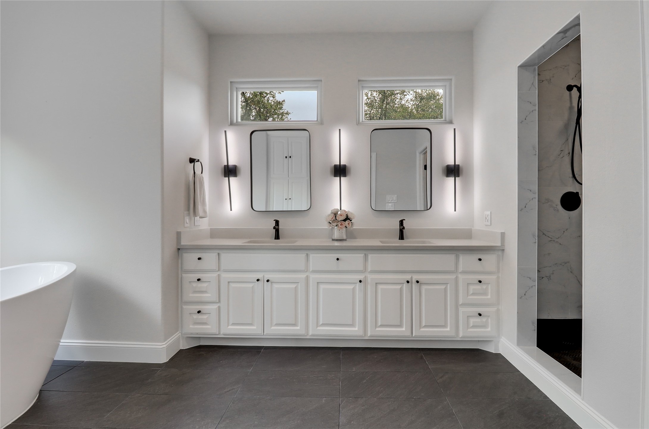 1100 Norwood Road Dripping Springs, TX 78620 - Photo 16 of 38 a bathroom with double vanity and a mirror