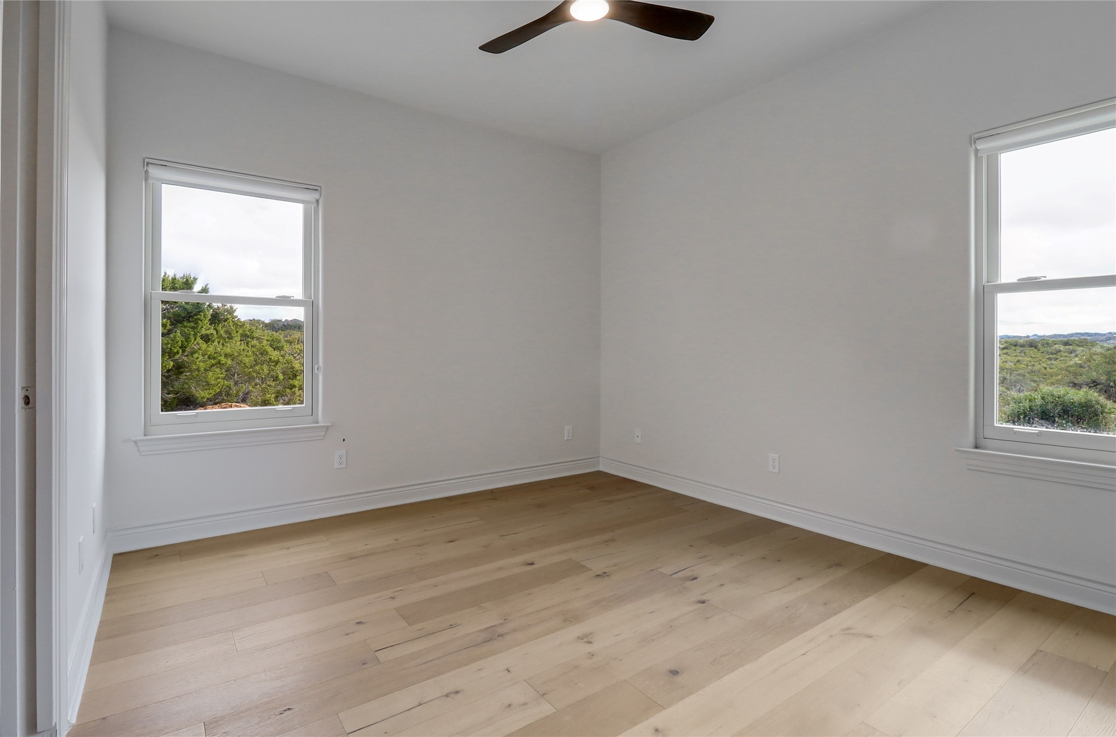 1100 Norwood Road Dripping Springs, TX 78620 - Photo 19 of 38 an empty room with a window