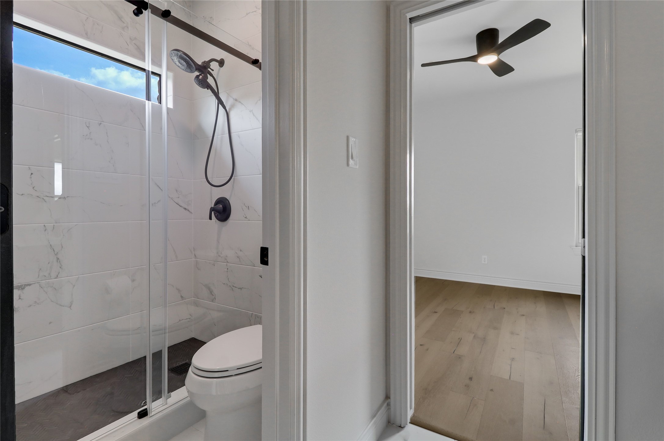 1100 Norwood Road Dripping Springs, TX 78620 - Photo 23 of 38 a bathroom with a toilet and a shower