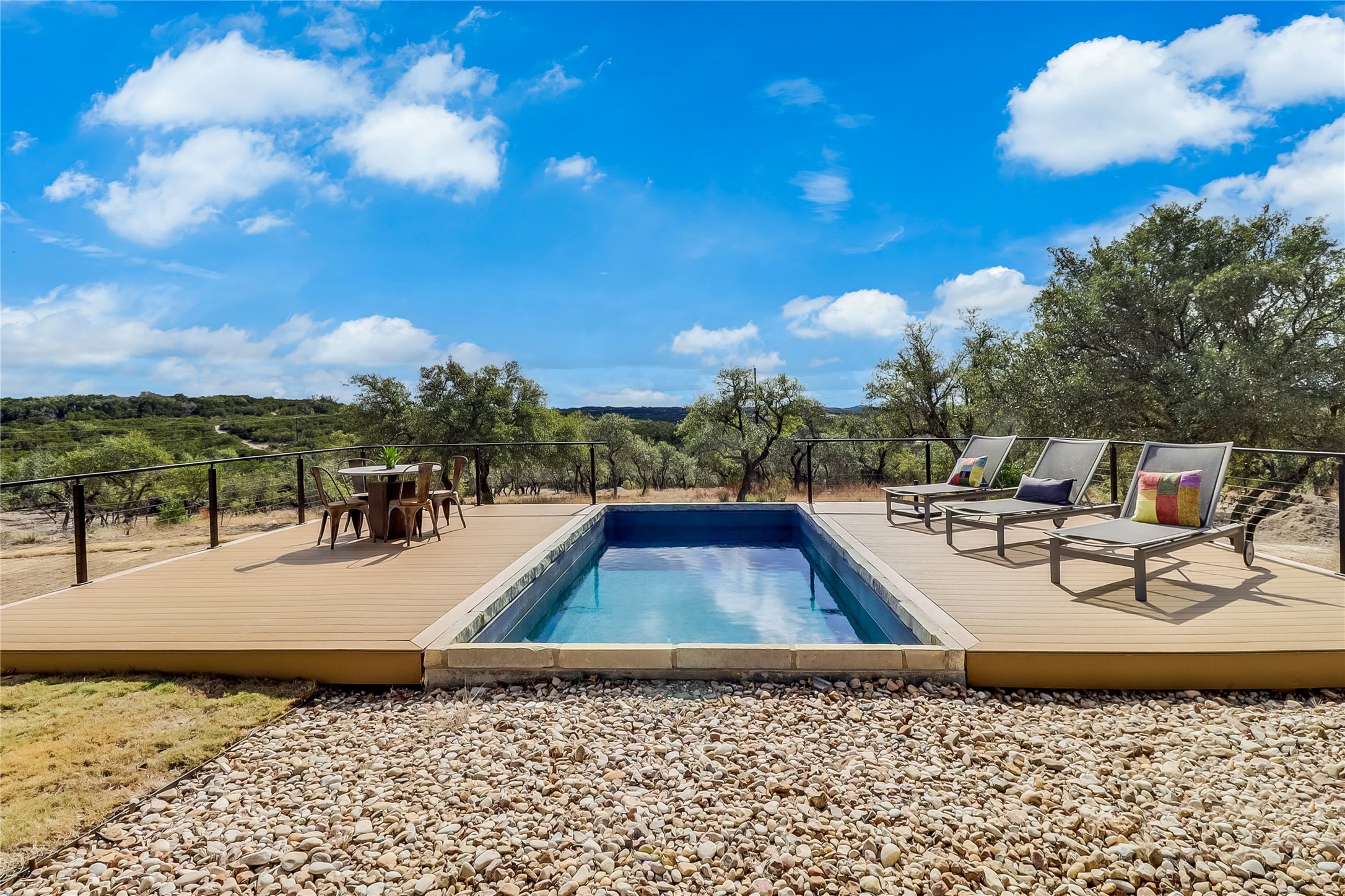 1100 Norwood Road Dripping Springs, TX 78620 - Photo 25 of 38 a view of a swimming pool with lounge chairs