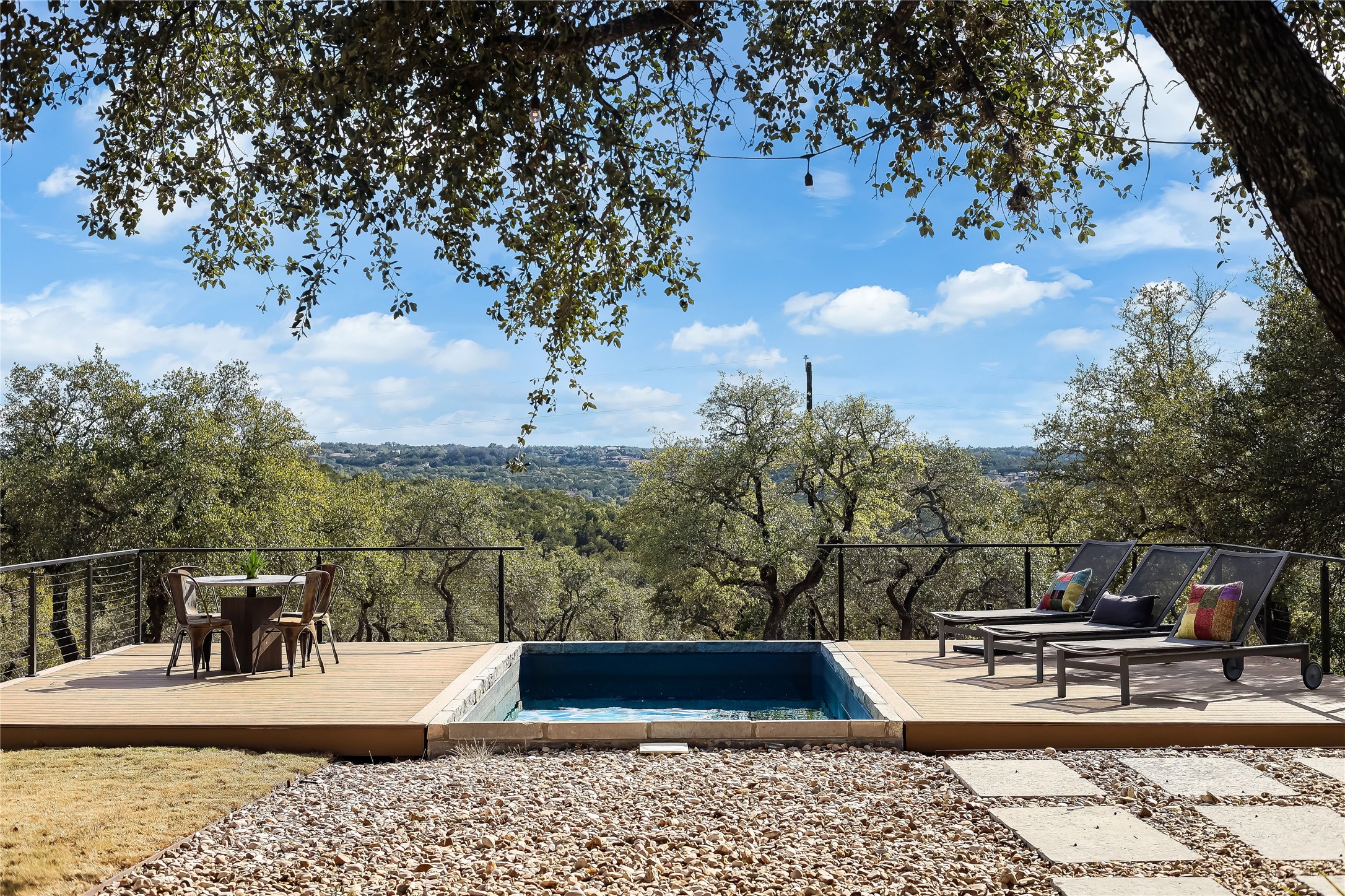1100 Norwood Road Dripping Springs, TX 78620 - Photo 26 of 38 a view of a swimming pool with a patio