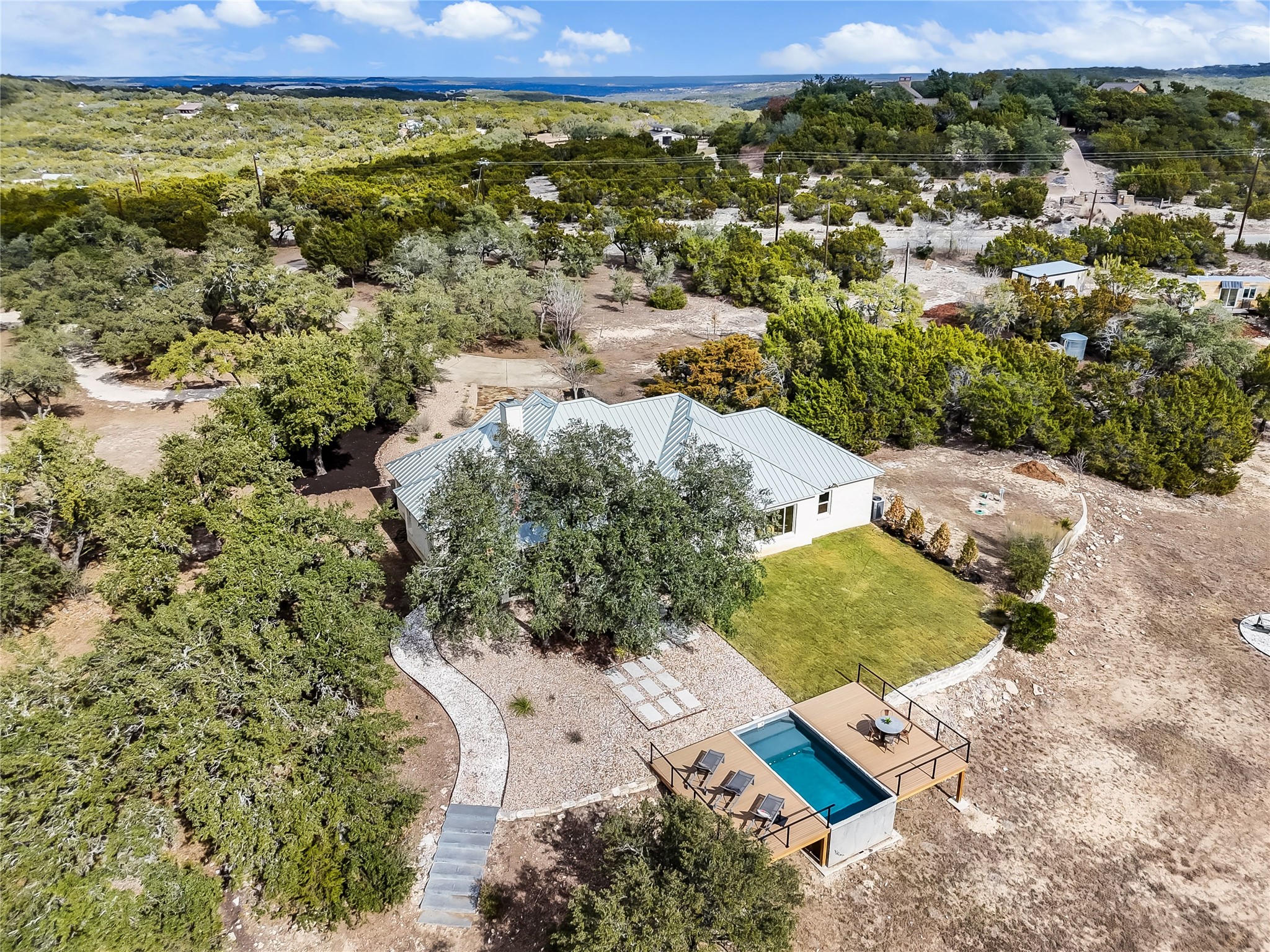 1100 Norwood Road Dripping Springs, TX 78620 - Photo 36 of 38 an aerial view of a house with a yard
