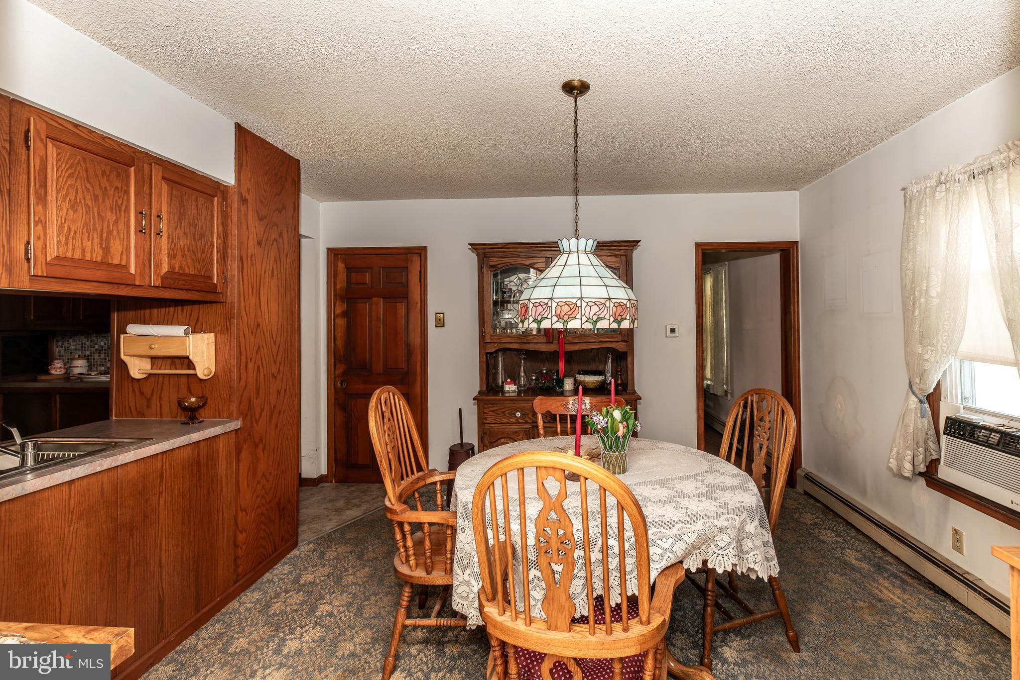 9516 Highland Street Mauricetown, NJ 08329 - Photo 15 of 53 a dining room with furniture a chandelier and window