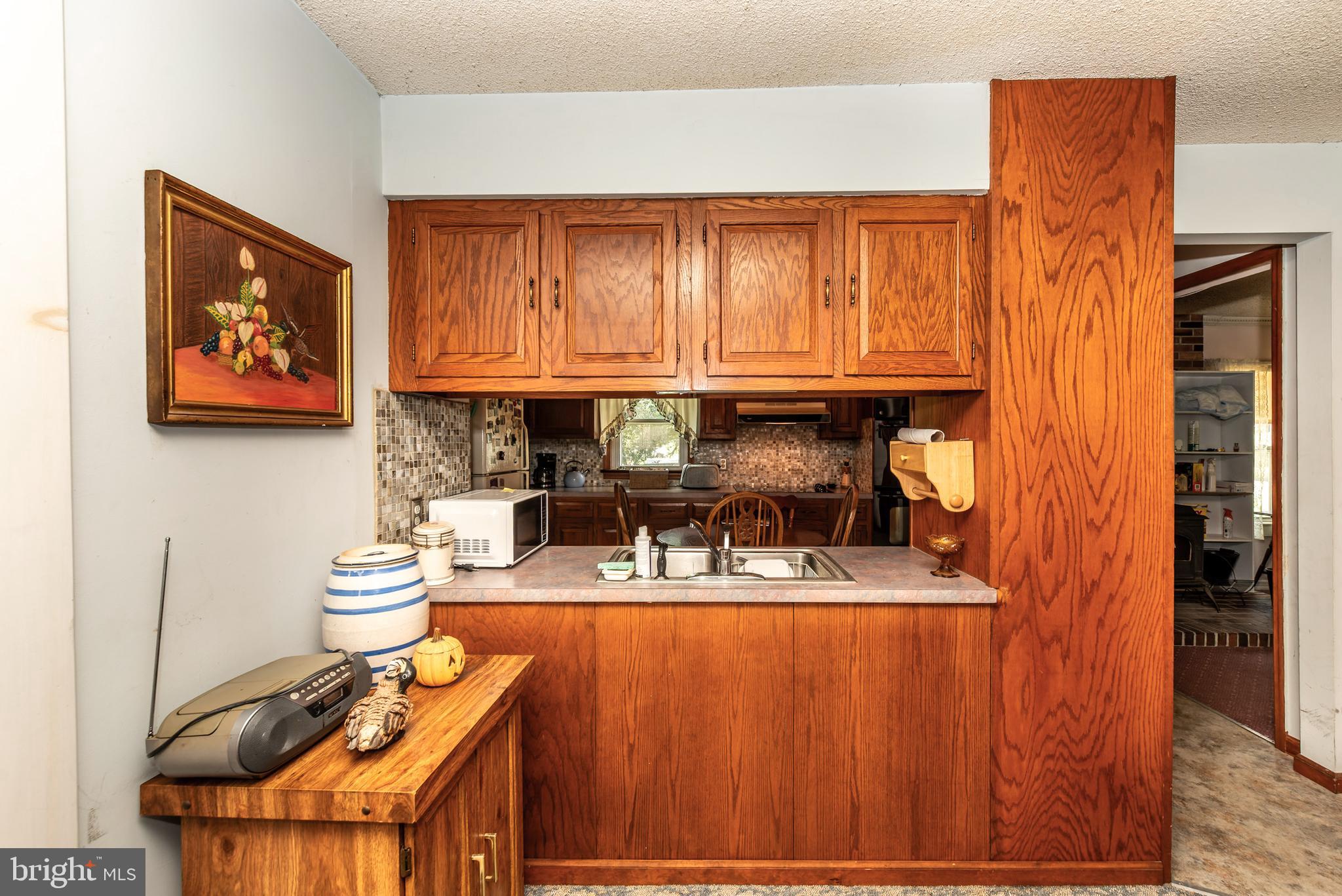 9516 Highland Street Mauricetown, NJ 08329 - Photo 16 of 53 a kitchen with stainless steel appliances granite countertop a refrigerator and a stove