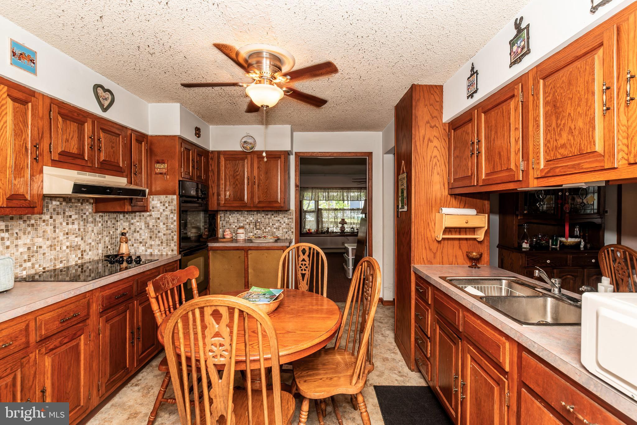 9516 Highland Street Mauricetown, NJ 08329 - Photo 21 of 53 a kitchen with stainless steel appliances granite countertop a sink and cabinets