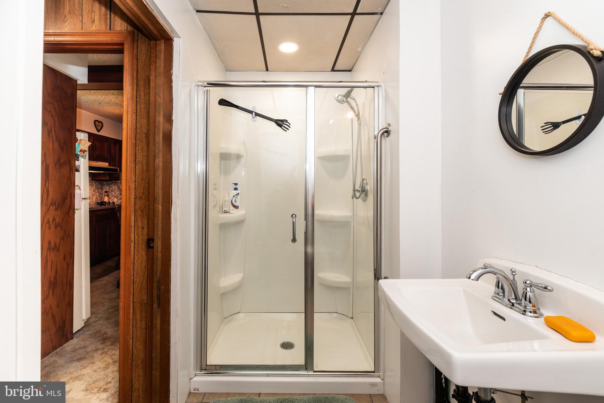 9516 Highland Street Mauricetown, NJ 08329 - Photo 24 of 53 a bathroom with a sink and a mirror
