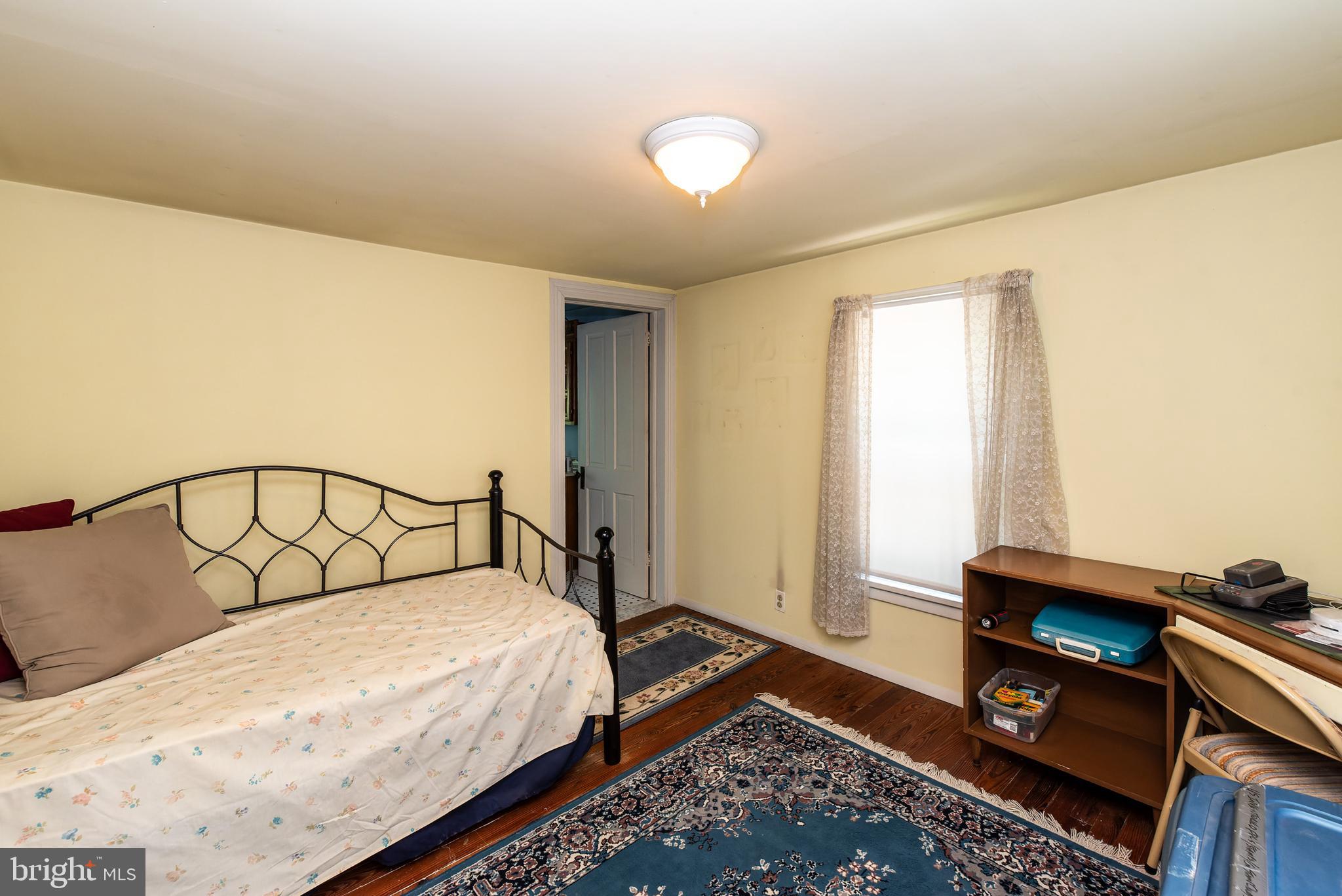 9516 Highland Street Mauricetown, NJ 08329 - Photo 34 of 53 a bedroom with a bed and a window