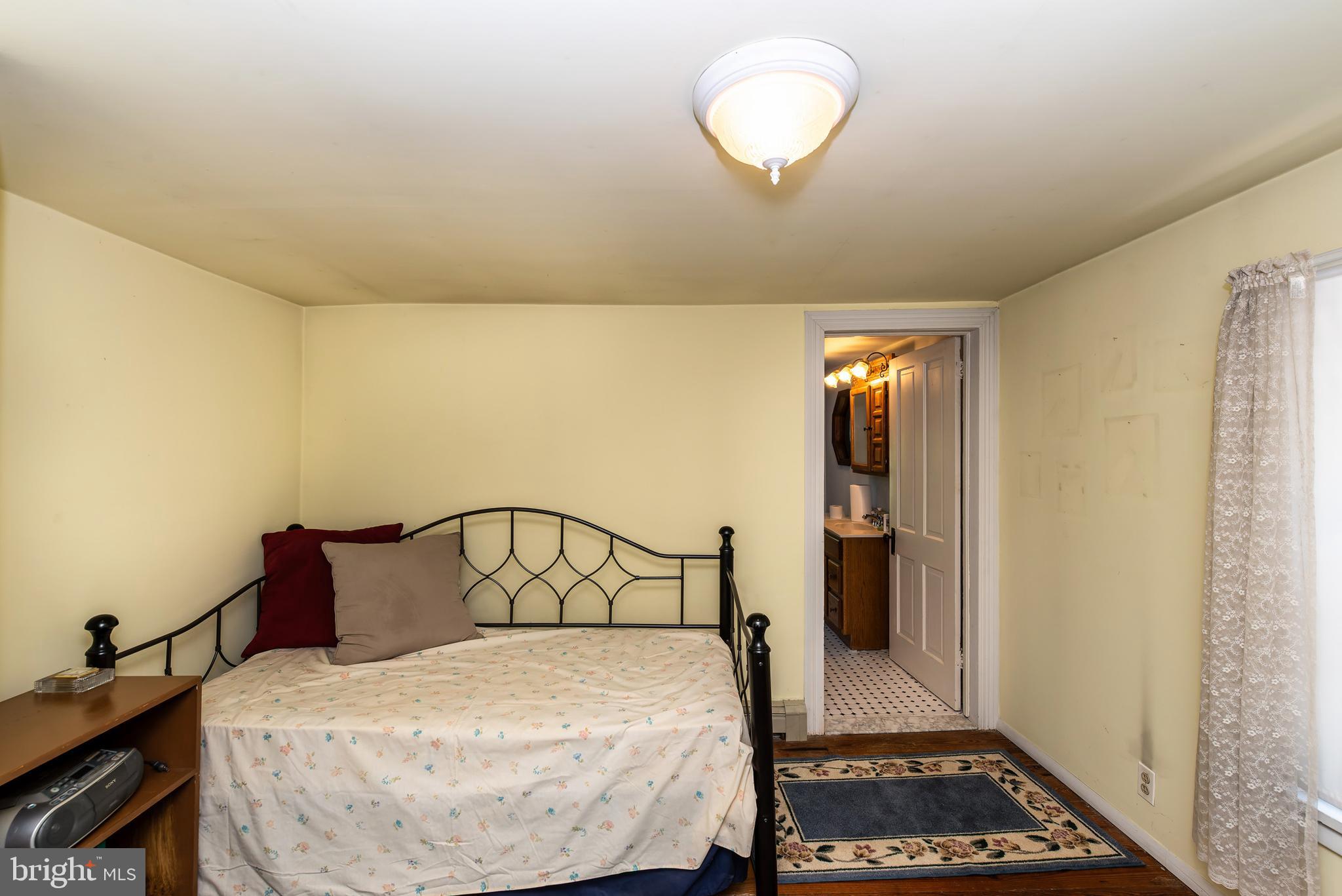 9516 Highland Street Mauricetown, NJ 08329 - Photo 35 of 53 a bedroom with a bed and a window