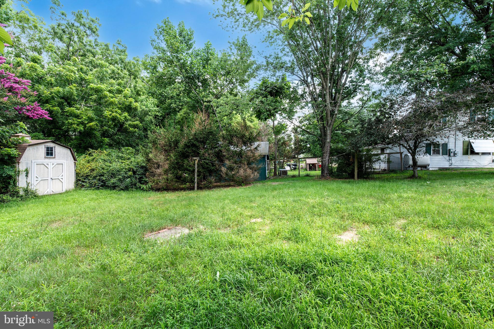 9516 Highland Street Mauricetown, NJ 08329 - Photo 48 of 53 a view of a backyard with a garden and entertaining space