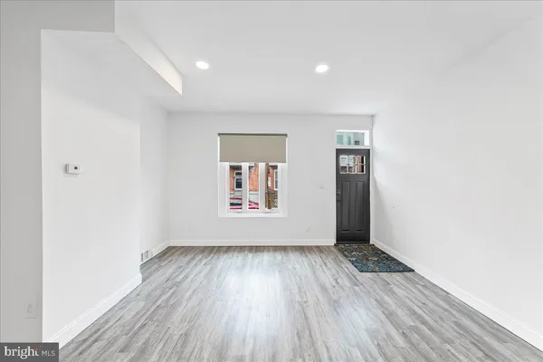 a view of entryway with wooden floor