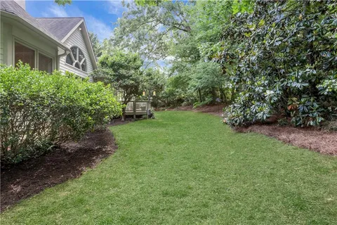 a view of a house with a outdoor space and garage