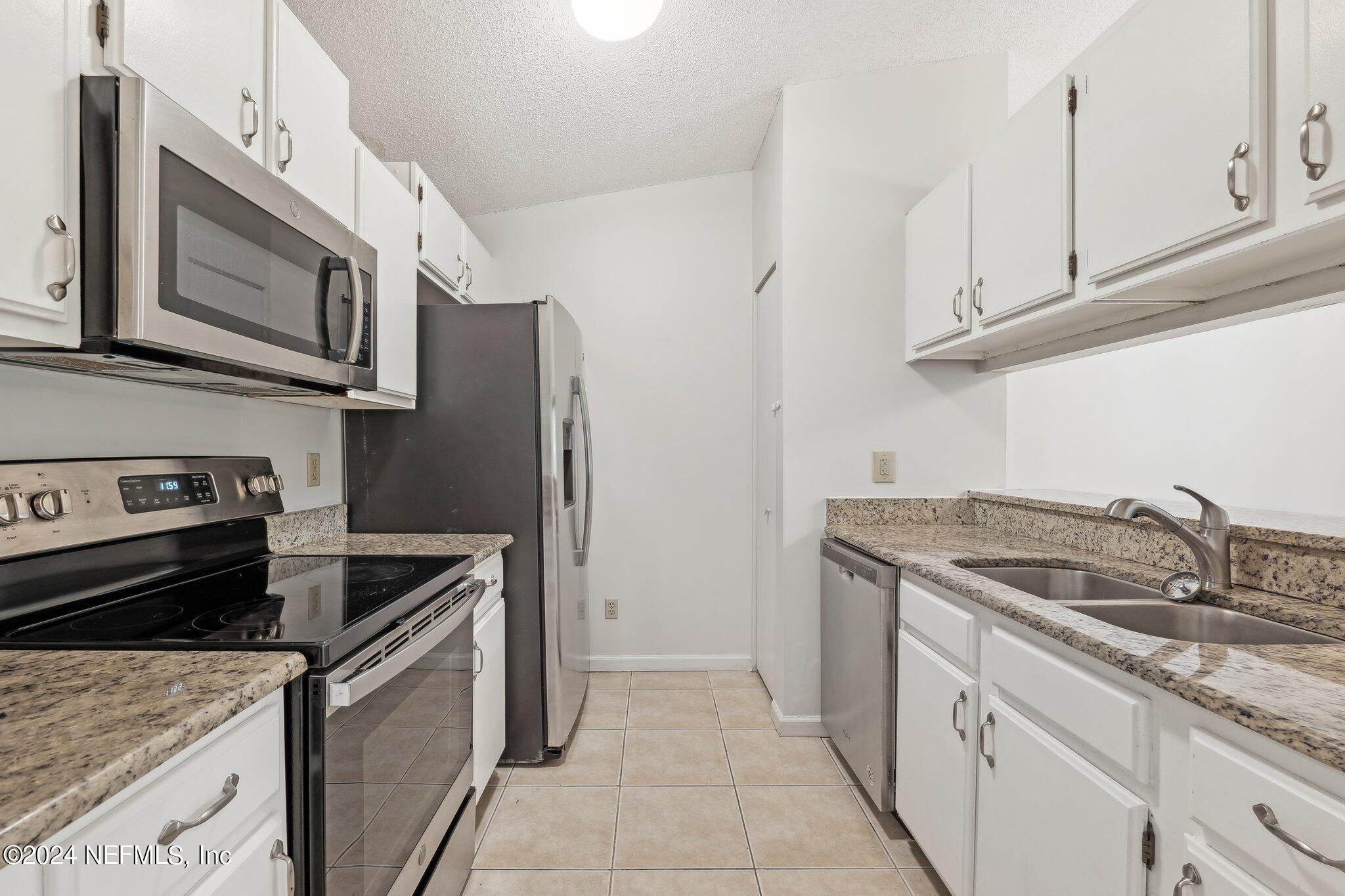 3270 Ricky Drive, Unit 1403 Jacksonville, FL 32223 - Photo 9 of 33 Updated Kitchen