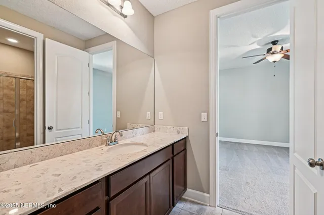 a bathroom with a shower and a toilet