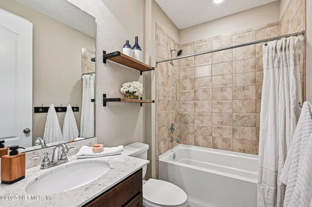 a view of an empty room with furniture window and wooden floor