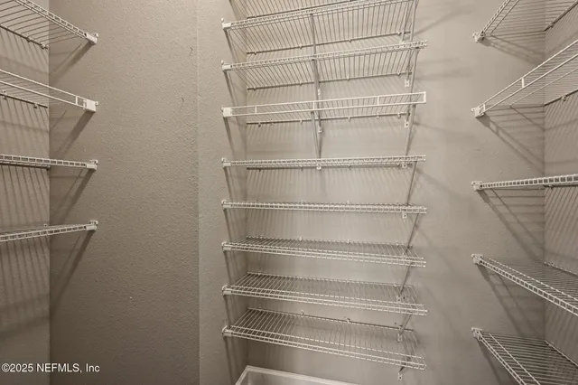 a bedroom with a bed dresser and a window