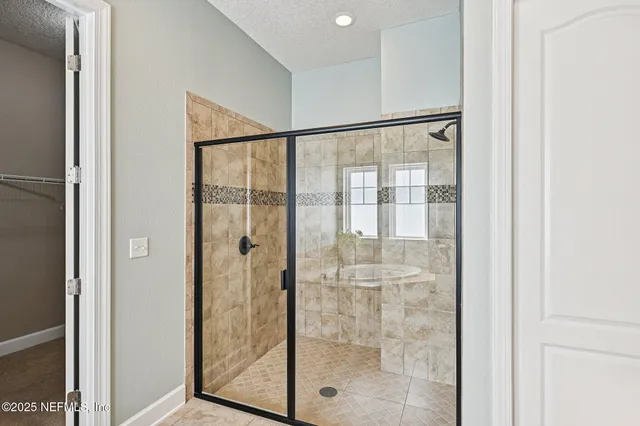 a white bath tub sitting in a bathroom