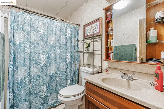 a kitchen with a stove top oven a sink and cabinets