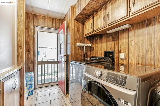 a view of a patio with table and chairs and potted plants