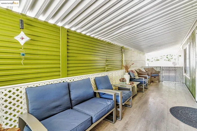 a roof deck with a table and chairs