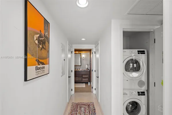 a living room with furniture and a book shelf