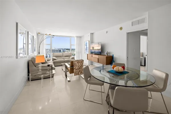 a living room with furniture and a table
