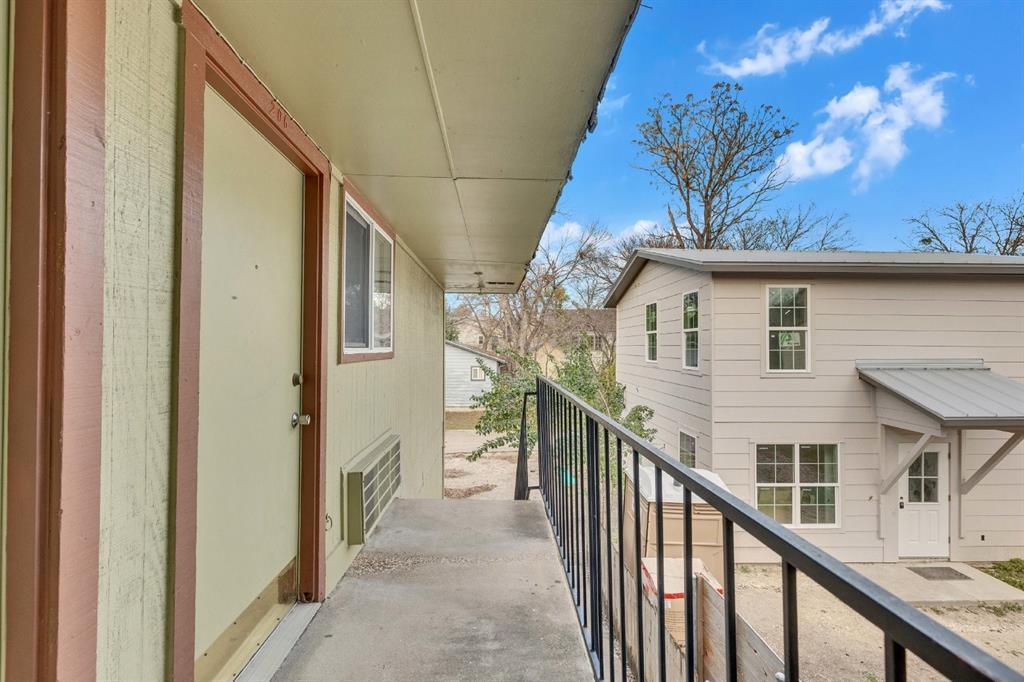 400 West 34th Street, Unit 102 Austin, TX 78705 - Photo 6 of 10 a view of a house with wooden fence and windows