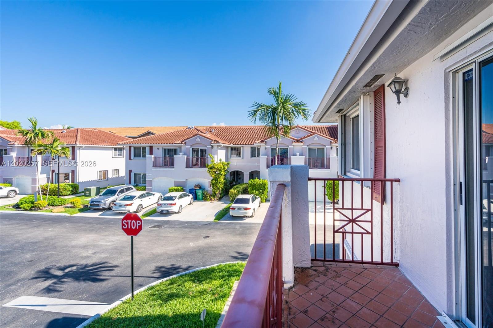 10245 Southwest 154th Place, Unit 1123 Miami, FL 33196 - Photo 33 of 38 a street view with tall buildings and a street
