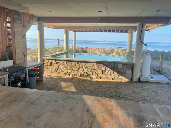 a view of a floor to a ceiling room and a window