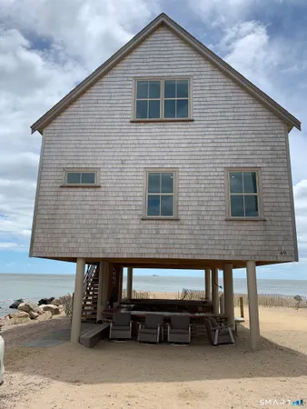 a view of a house with car parked