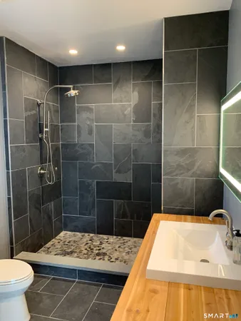 a bathroom with a bathtub and a sink