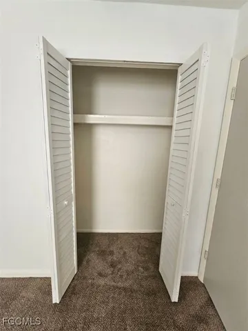 a bathroom with a sink a toilet a mirror a bathtub and shower