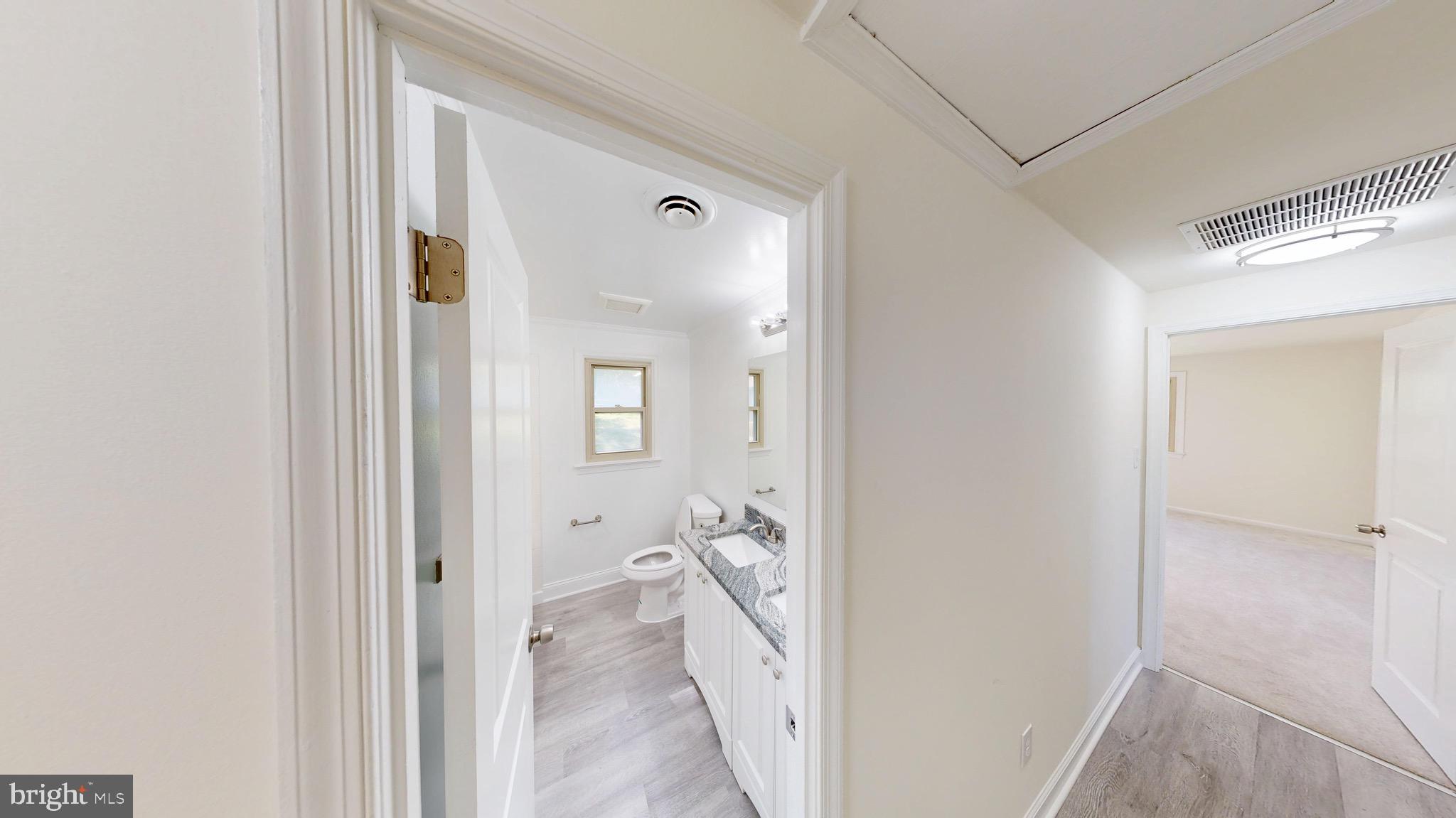 729 West Watersville Road Mount Airy, MD 21771 - Photo 14 of 42 a view of a bathroom from a hallway