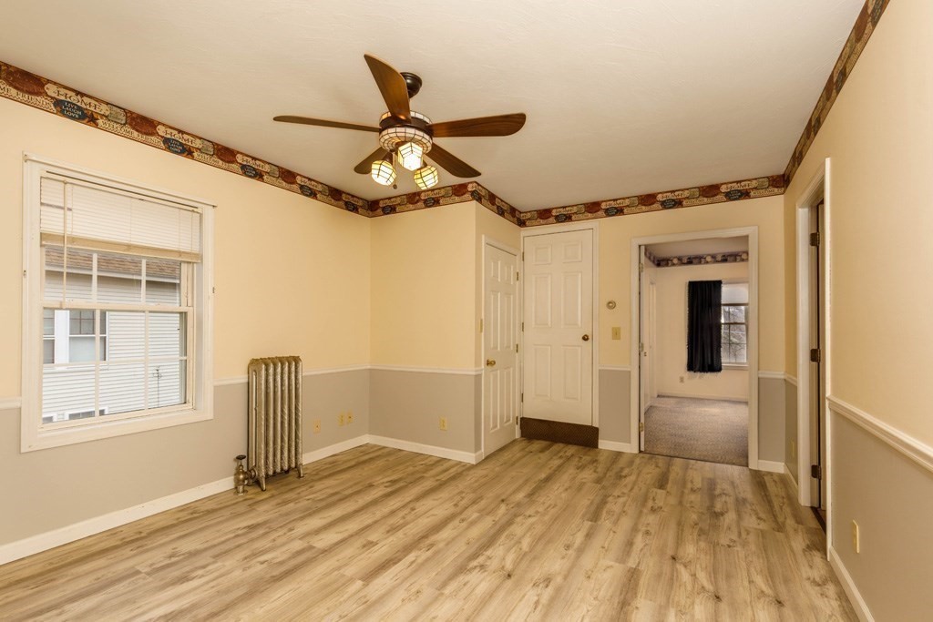 42 Prospect Street Athol, MA 01331 - Photo 11 of 20 a view of empty room with wooden floor and fan