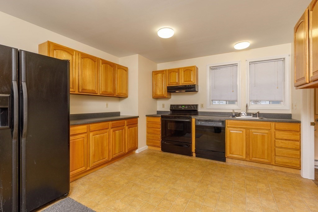 42 Prospect Street Athol, MA 01331 - Photo 2 of 20 a kitchen with stainless steel appliances granite countertop a stove a sink dishwasher a refrigerator and a stove top oven