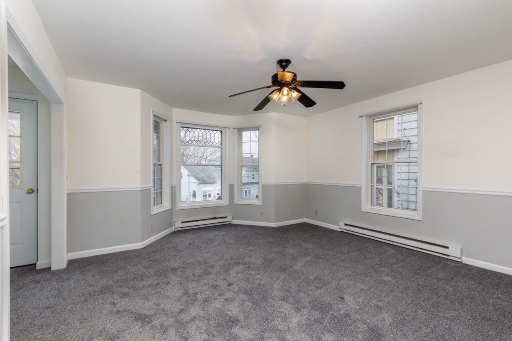 42 Prospect Street Athol, MA 01331 - Photo 4 of 20 a view of room with a ceiling fan and window