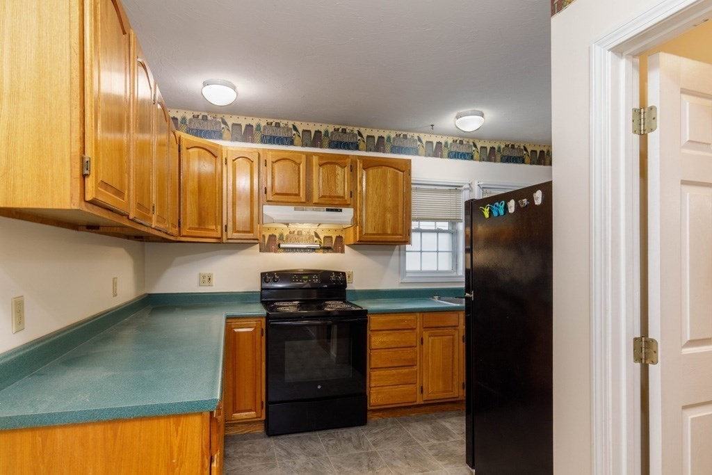 42 Prospect Street Athol, MA 01331 - Photo 9 of 20 a kitchen with stainless steel appliances granite countertop a stove a refrigerator and a sink