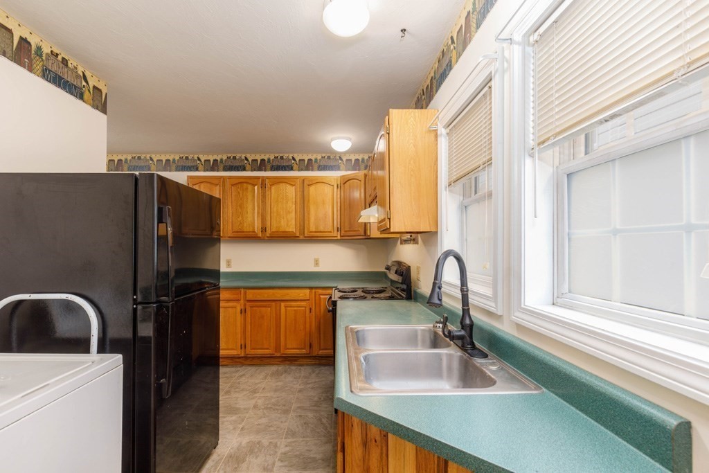 42 Prospect Street Athol, MA 01331 - Photo 10 of 20 a kitchen with a sink a counter top space and stainless steel appliances