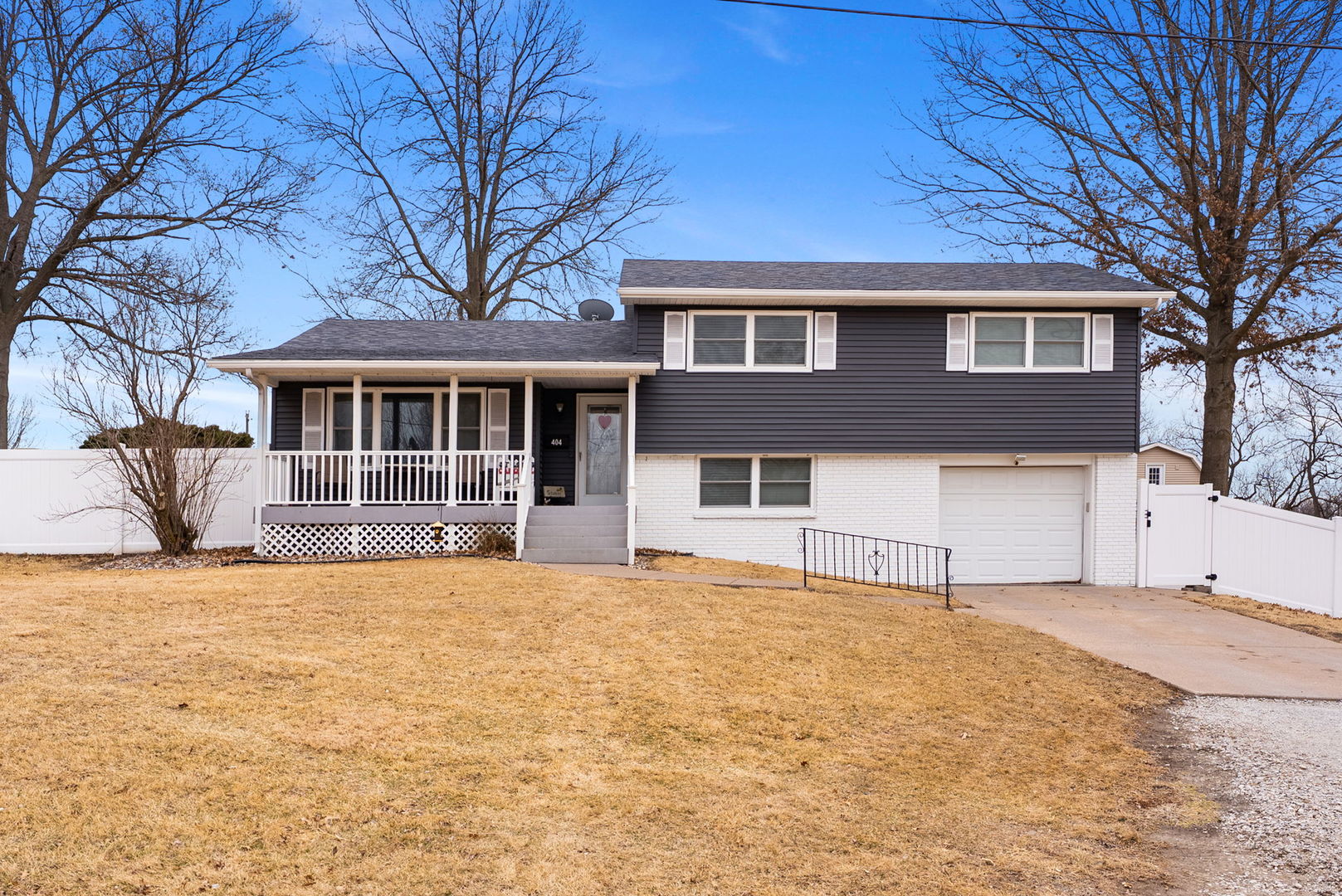 404 Southwest 10th Street Aledo, IL 61231 - Photo 1 of 27 a front view of a house with a yard
