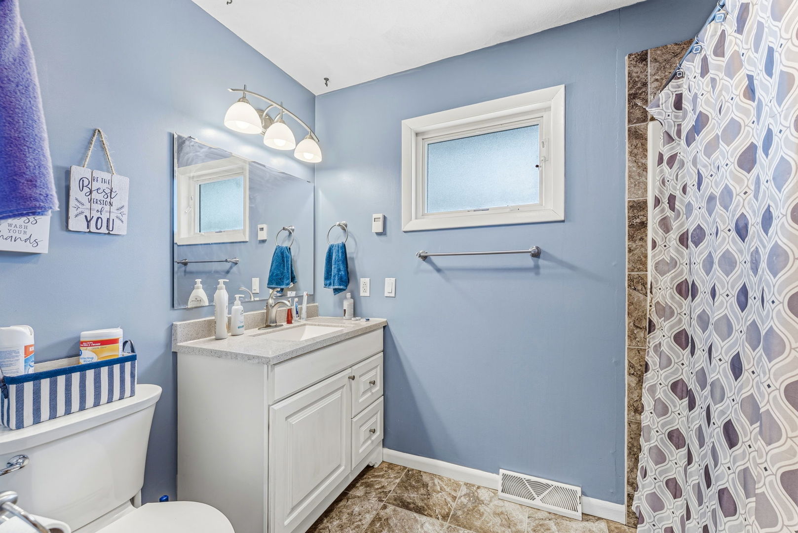 404 Southwest 10th Street Aledo, IL 61231 - Photo 13 of 27 a bathroom with a sink toilet and mirror