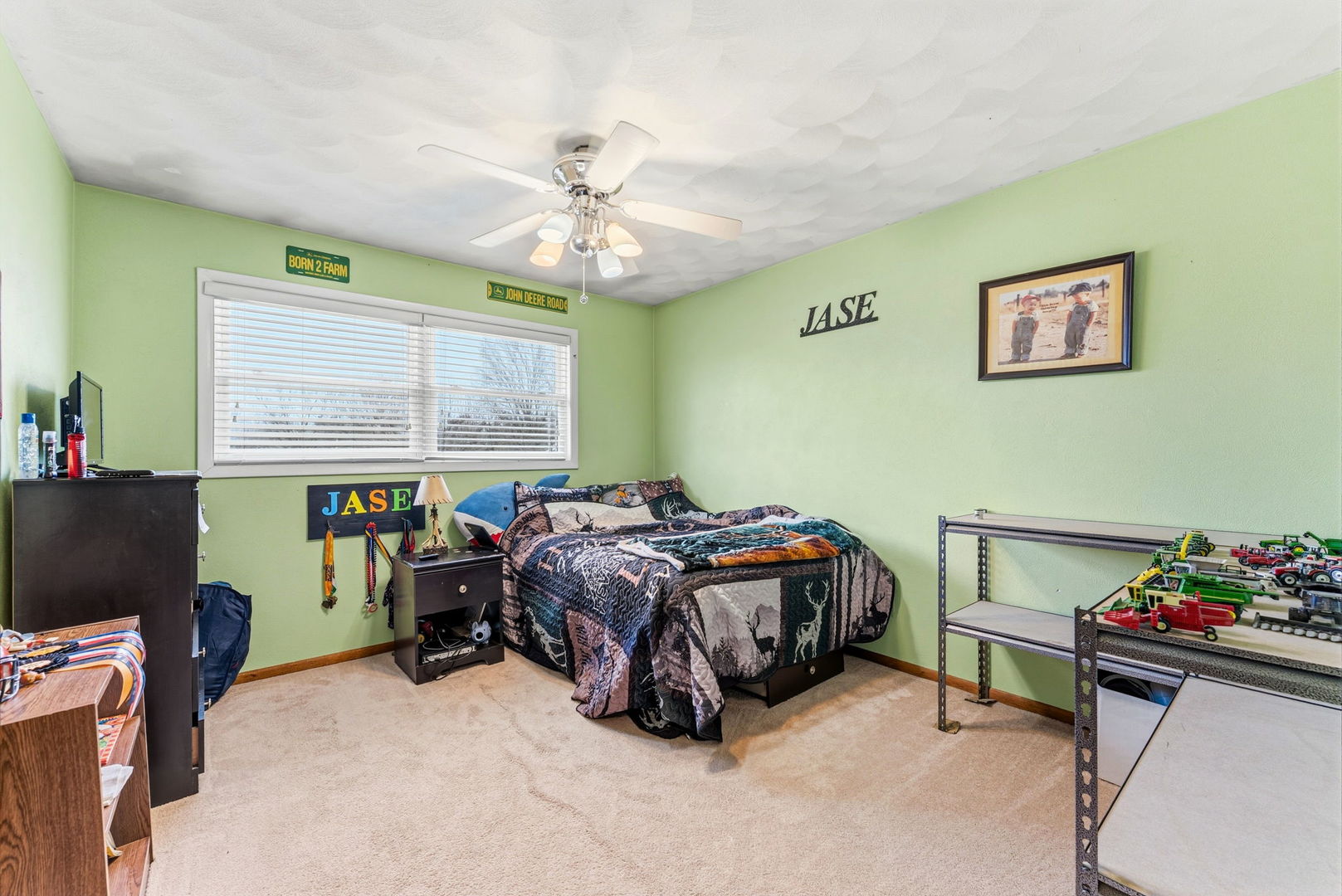 404 Southwest 10th Street Aledo, IL 61231 - Photo 16 of 27 a bedroom with a bed and a chandelier