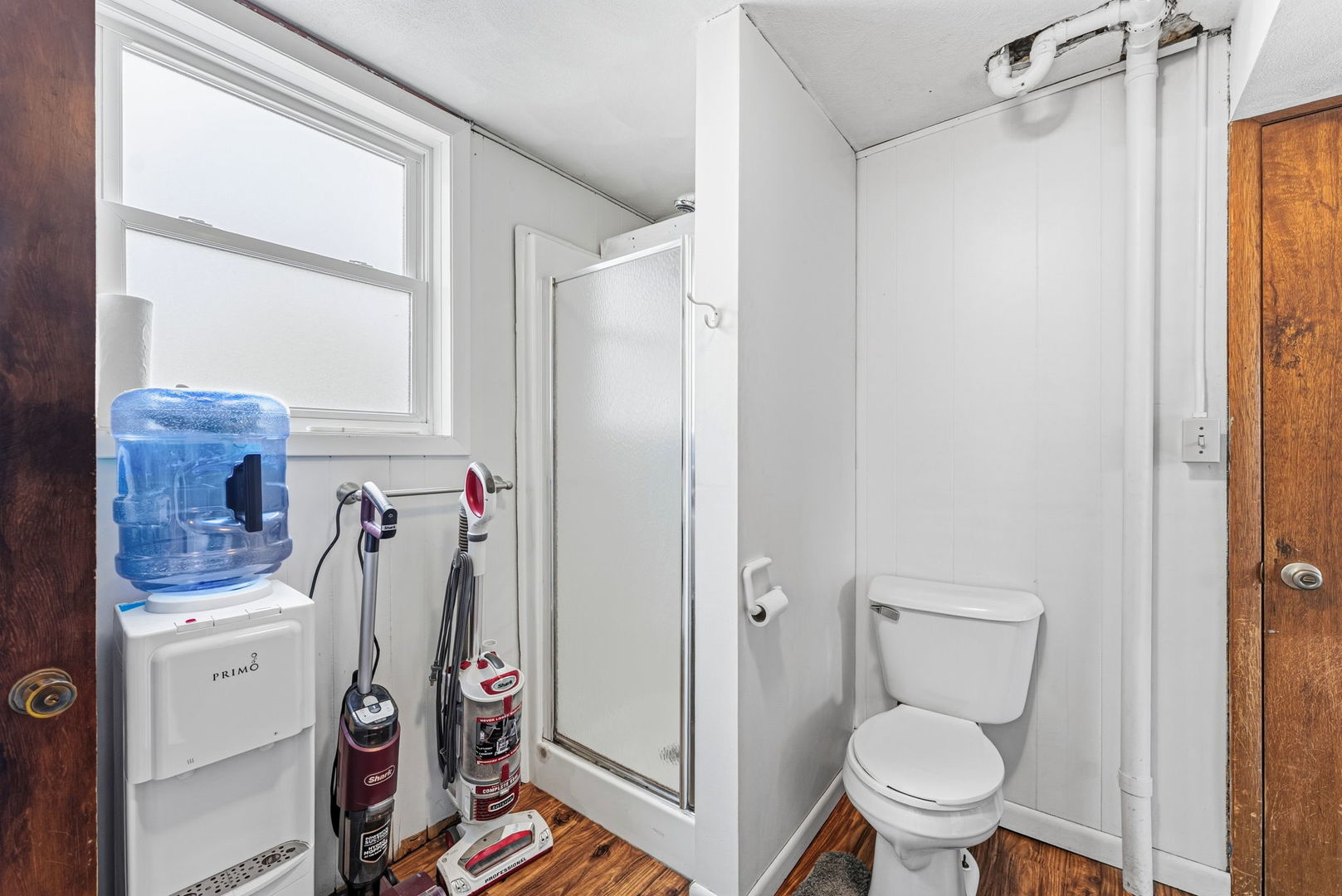 404 Southwest 10th Street Aledo, IL 61231 - Photo 19 of 27 a bathroom with a toilet and a shower